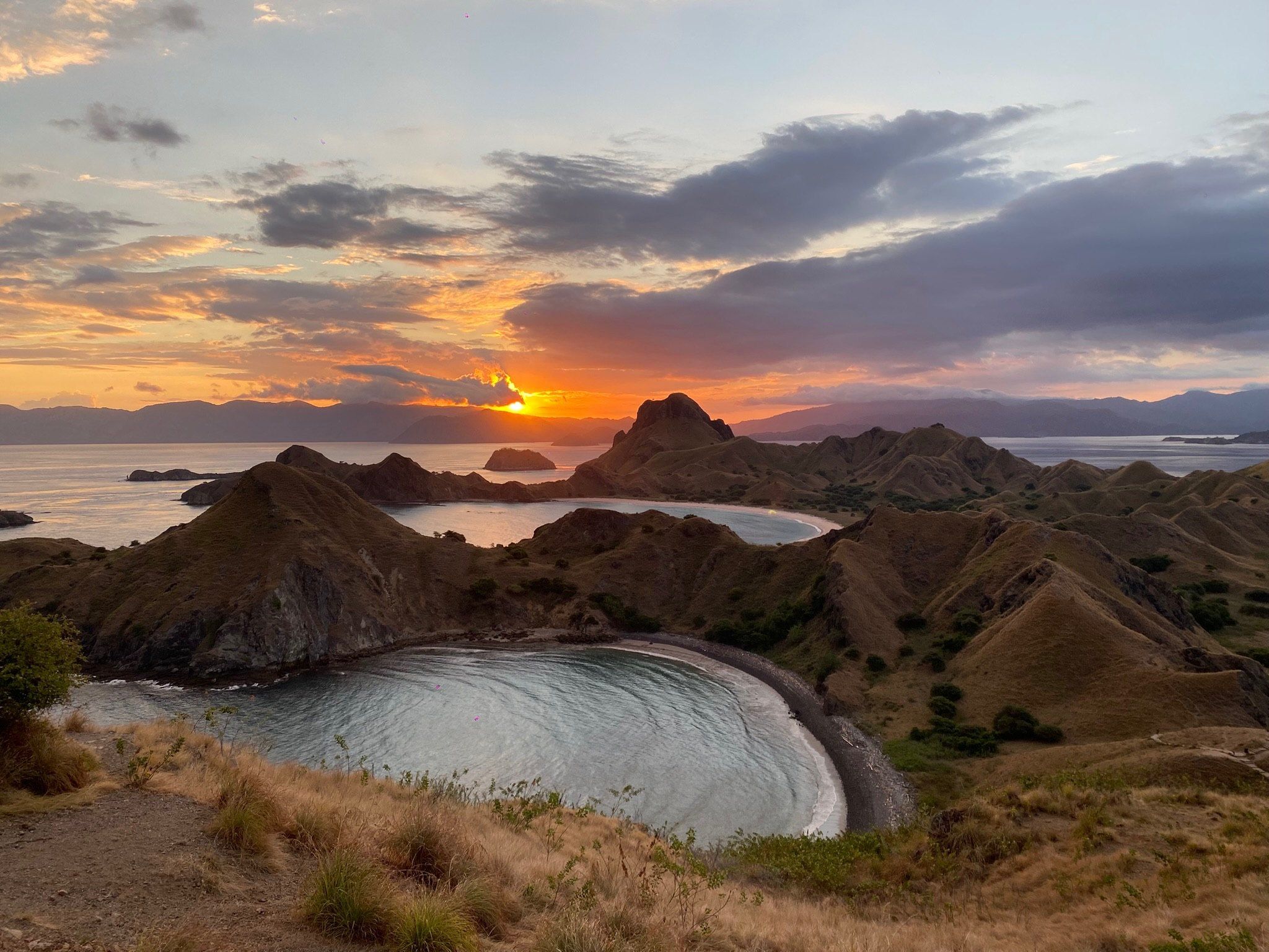 A volcanic ridge above a cove at golden hour