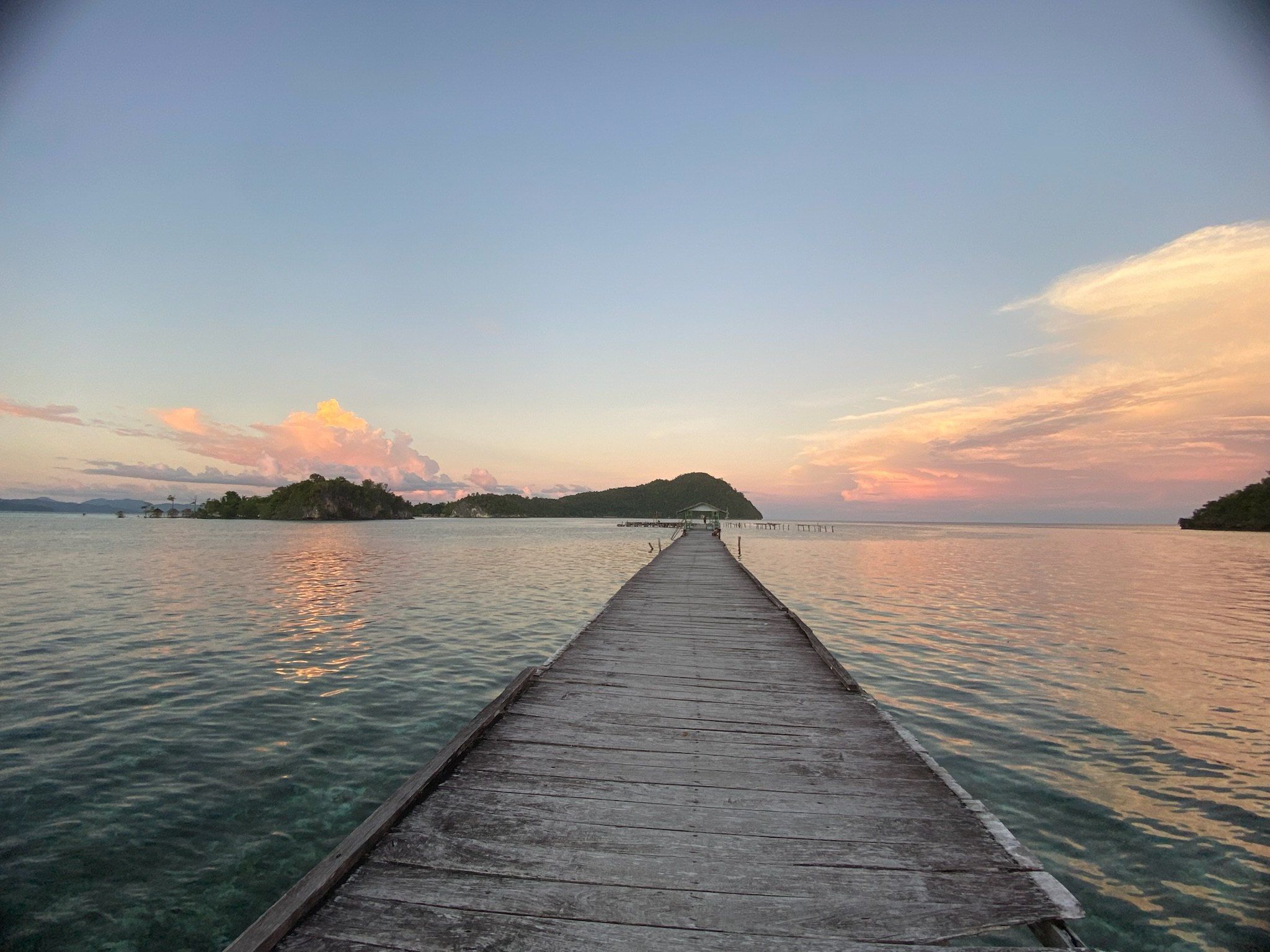 A long wooden jetty at dusk