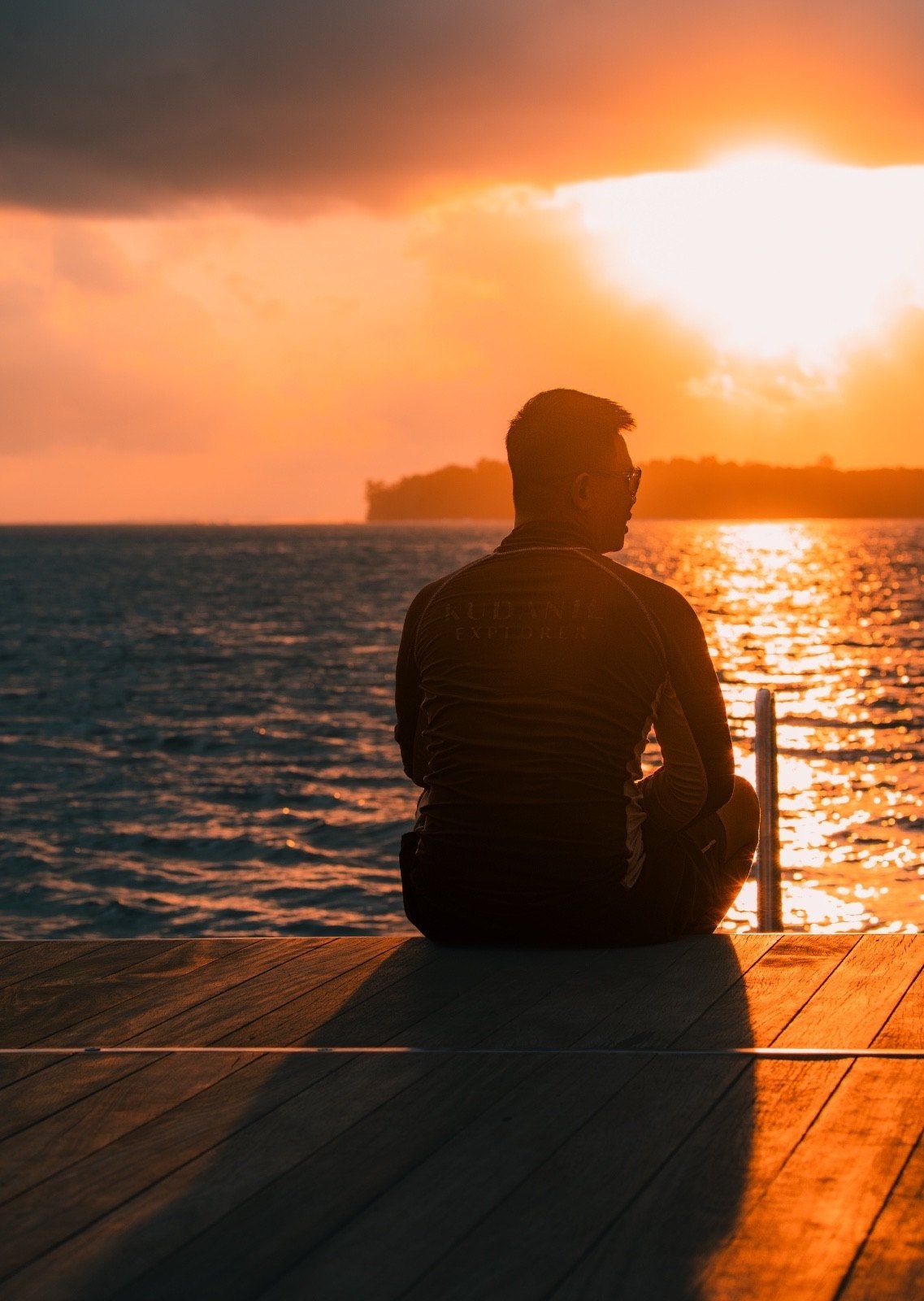 Guest watching the sunset from the deck