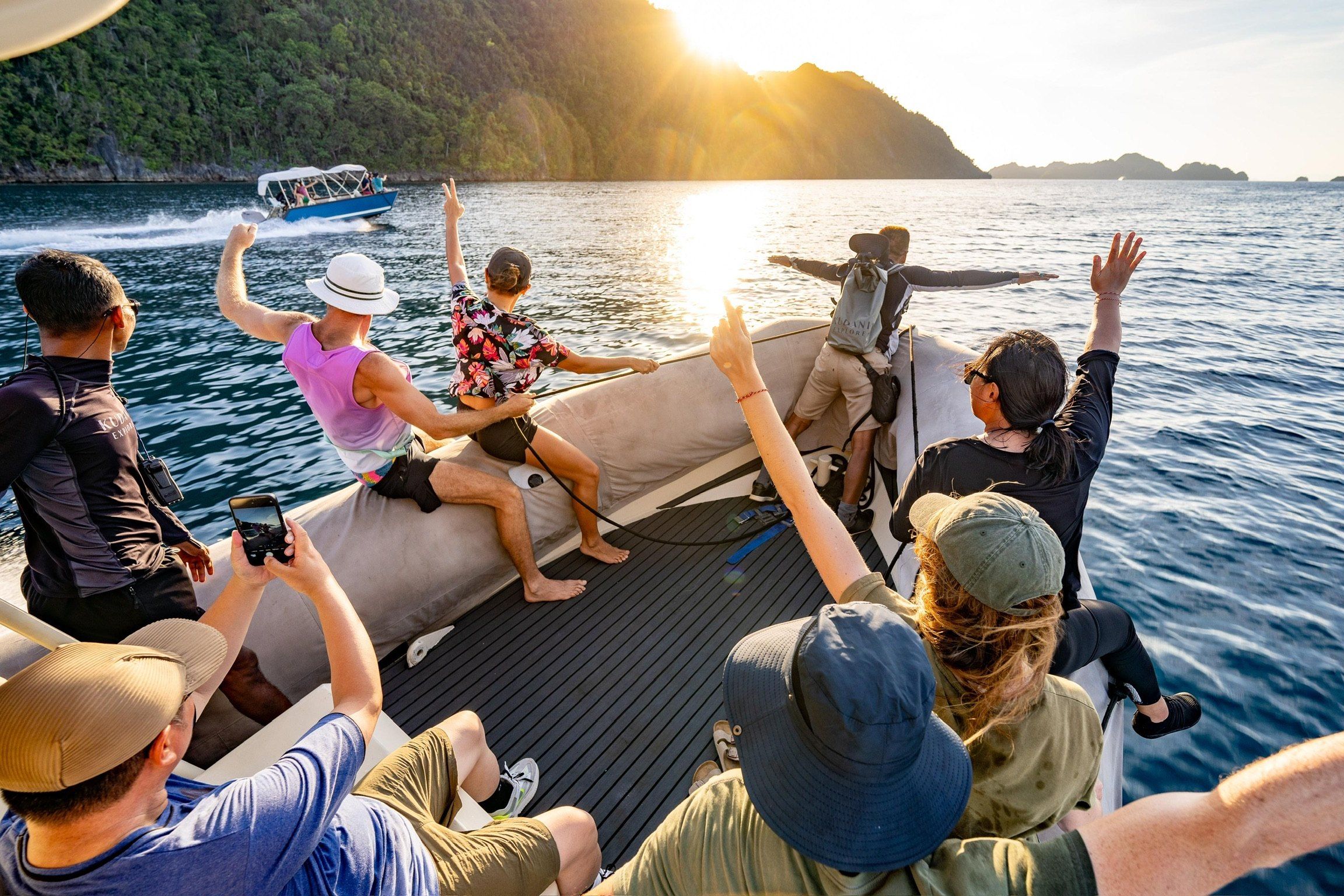 Guests waving from the tender